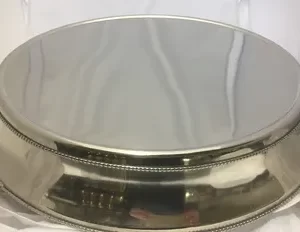 Close image of silver polished cake stand